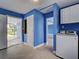 A brightly lit laundry room that offers a modern washer and dryer and is conveniently located near the carport at 1295 S Maryknoll Rd, Englewood, FL 34223
