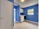 Well-lit laundry room with modern machines and storage cabinets for organization and convenience at 1295 S Maryknoll Rd, Englewood, FL 34223