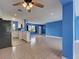 Bright living area with an open design, flowing into a modern kitchen with stainless appliances at 1295 S Maryknoll Rd, Englewood, FL 34223