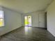 Bright bedroom featuring a sliding glass door and wood-look tile flooring at 14149 Whittier Ln, Port Charlotte, FL 33981