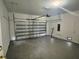 Spacious garage with an automated door and sealed concrete flooring at 14149 Whittier Ln, Port Charlotte, FL 33981
