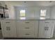 White kitchen island featuring drawers, cabinets, and quartz countertops at 14149 Whittier Ln, Port Charlotte, FL 33981