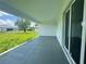 Covered patio with sliding glass doors and a view of the backyard at 14149 Whittier Ln, Port Charlotte, FL 33981