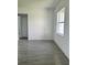 Bright, modern room with tile floors, white walls, one window, and a closet at 14149 Whittier Ln, Port Charlotte, FL 33981