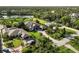 Expansive aerial view of luxury waterfront home with lush landscaping and private dock in desirable area at 1415 Bayshore Dr, Englewood, FL 34223
