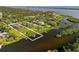 Stunning aerial showcases waterfront home, private dock, and desirable location at 1415 Bayshore Dr, Englewood, FL 34223