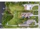 Beautiful aerial view of the backyard, pool, and waterfront of this lovely home at 1415 Bayshore Dr, Englewood, FL 34223