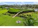 Backyard aerial view, wooden walkway to a dock and stunning waterfront views at 1415 Bayshore Dr, Englewood, FL 34223