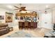 Spacious bar area with aviation decor, seating, and ample storage at 1415 Bayshore Dr, Englewood, FL 34223