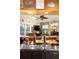 Home bar area with metal counter, beer taps, and views of the living room at 1415 Bayshore Dr, Englewood, FL 34223