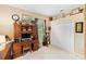 Bedroom with a desk area, white carpet, and a view to the backyard at 1415 Bayshore Dr, Englewood, FL 34223
