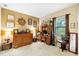 Comfortable bedroom showcasing wood furniture, neutral walls, and cozy carpeting at 1415 Bayshore Dr, Englewood, FL 34223