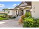 Charming home exterior with well-maintained landscaping and inviting entryway, showcasing curb appeal at 1415 Bayshore Dr, Englewood, FL 34223