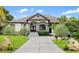 Beautiful home with a well-manicured lawn and an inviting entrance at 1415 Bayshore Dr, Englewood, FL 34223