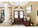Inviting foyer with double doors, decorative rug, and elegant decor at 1415 Bayshore Dr, Englewood, FL 34223