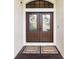 Double front doors with glass panels and decorative wreaths at 1415 Bayshore Dr, Englewood, FL 34223