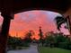 Beautiful sunset view from porch overlooking neighborhood at 1415 Bayshore Dr, Englewood, FL 34223