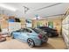 Two-car garage showcasing a blue and black sedan at 1415 Bayshore Dr, Englewood, FL 34223
