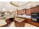 Well-equipped kitchen boasts granite countertops, dark wood cabinets, and stainless steel appliances at 1415 Bayshore Dr, Englewood, FL 34223