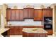 Beautiful kitchen with granite countertops, stylish backsplash, and custom cabinetry with stainless steel appliances at 1415 Bayshore Dr, Englewood, FL 34223
