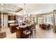 Gourmet kitchen features dual islands, granite countertops, custom cabinetry, and an adjacent breakfast nook at 1415 Bayshore Dr, Englewood, FL 34223