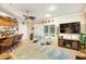 Bright living area showcases bar seating, sliding doors to the pool, and comfortable furniture at 1415 Bayshore Dr, Englewood, FL 34223
