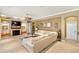 Comfortable living room with fireplace, built-in shelving, and neutral decor for a welcoming atmosphere at 1415 Bayshore Dr, Englewood, FL 34223