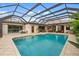 Inviting screened-in pool area with plenty of space for entertaining and outdoor dining at 1415 Bayshore Dr, Englewood, FL 34223