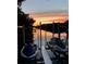 Waterfront area featuring two jet skis during a beautiful sunset at 1415 Bayshore Dr, Englewood, FL 34223