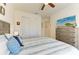 Bedroom with a nautical theme bed, a ceiling fan, a closet, and a dresser with a TV at 15498 Seafoam Cir, Port Charlotte, FL 33981