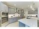 Modern kitchen with granite countertops, stainless steel appliances, and a large central island at 15498 Seafoam Cir, Port Charlotte, FL 33981