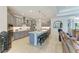 Modern kitchen with granite countertops, stainless steel appliances, and a large central island at 15498 Seafoam Cir, Port Charlotte, FL 33981