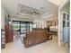 Open-concept living area with water views, modern furnishings, and access to the outdoor living space at 15498 Seafoam Cir, Port Charlotte, FL 33981