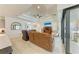 This living room has a large sliding door to a lanai area with access to the kitchen and dining room at 15498 Seafoam Cir, Port Charlotte, FL 33981