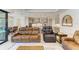 An open living area that connects to the dining area, offering a serene view of the pool at 15498 Seafoam Cir, Port Charlotte, FL 33981