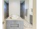 Luxurious bathroom featuring a standalone tub, walk-in shower, double vanity, and modern fixtures at 15498 Seafoam Cir, Port Charlotte, FL 33981