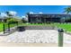 Beautiful backyard area with paver patio, lush green lawn, and screened-in lanai, perfect for outdoor enjoyment at 15498 Seafoam Cir, Port Charlotte, FL 33981