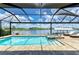 Beautiful screened-in pool and spa combination offering stunning water views for ultimate relaxation and enjoyment at 15498 Seafoam Cir, Port Charlotte, FL 33981
