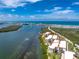 Picture of condos on the water featuring a community pool, dock, and beautiful scenery, perfect for waterfront living at 1701 Beach Rd # 207, Englewood, FL 34223