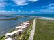 Capture of waterfront condos featuring a pool, dock, boat, and scenic views, ideal for enjoying waterfront living at 1701 Beach Rd # 207, Englewood, FL 34223