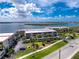 Aerial view of condos highlighting the lush landscaping, waterfront views, and nearby access to local routes at 1701 Beach Rd # 207, Englewood, FL 34223