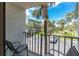Balcony overlooking the parking lot with views of the well-maintained surrounding community at 1701 Beach Rd # 207, Englewood, FL 34223