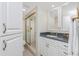 Bathroom featuring a walk-in shower and blue countertop at 1701 Beach Rd # 207, Englewood, FL 34223