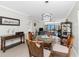 Elegant dining area with stylish lighting, seating, and water views at 1701 Beach Rd # 207, Englewood, FL 34223