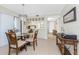 Inviting dining area adjacent to kitchen, offering a view of the entryway at 1701 Beach Rd # 207, Englewood, FL 34223