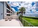Building exterior boasting a spacious waterfront patio for outdoor enjoyment and scenic views at 1701 Beach Rd # 207, Englewood, FL 34223