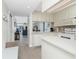 Bright kitchen flowing into the living area with waterfront view and breakfast bar at 1701 Beach Rd # 207, Englewood, FL 34223