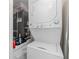 Laundry area with stacked washer and dryer at 1701 Beach Rd # 207, Englewood, FL 34223