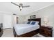 Spacious main bedroom featuring a king bed, nightstands, and modern decor at 1701 Beach Rd # 207, Englewood, FL 34223