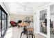 Bright sunroom featuring a view into the living room and sliding glass doors to a patio at 1701 Beach Rd # 207, Englewood, FL 34223